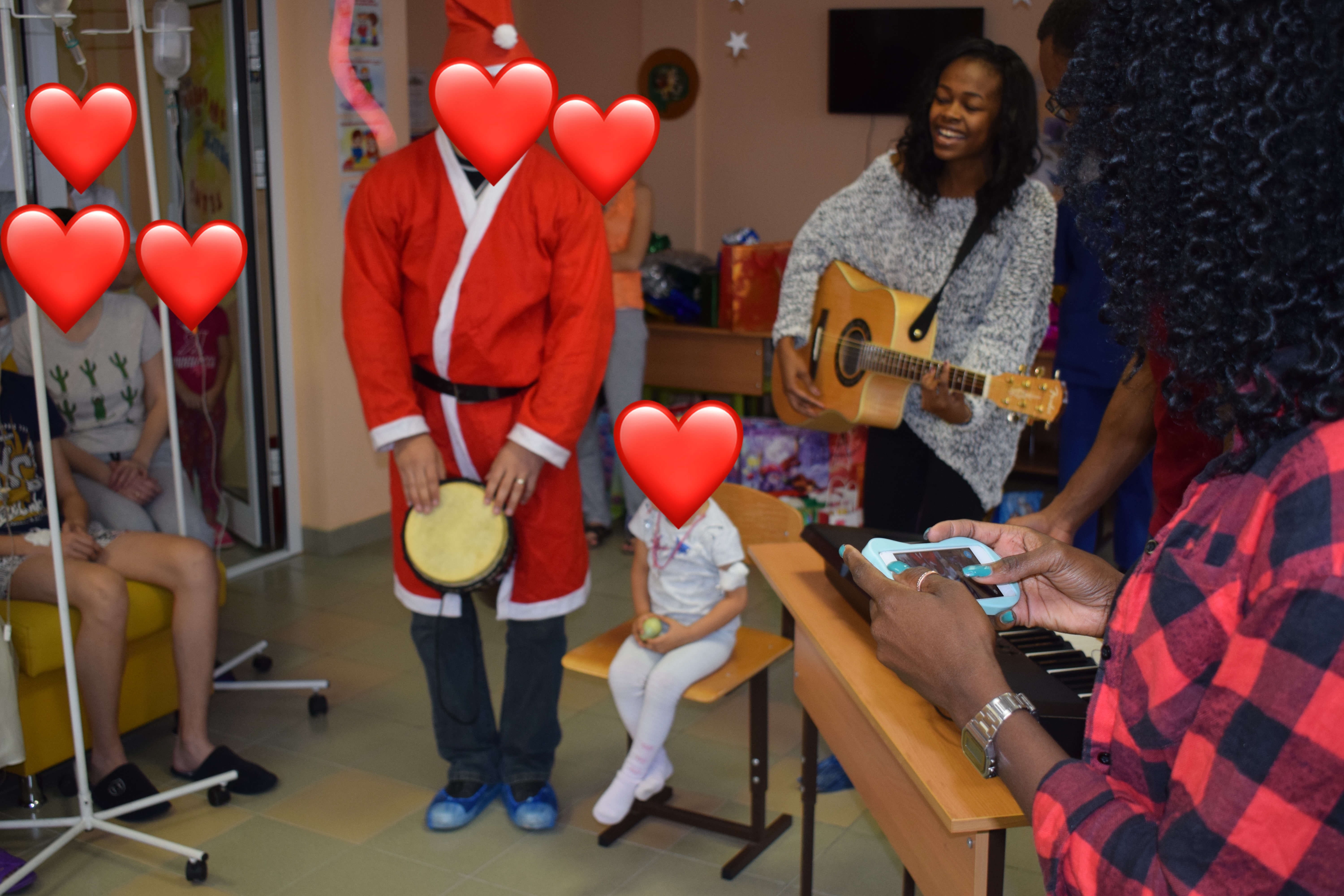 Playing the guitar during a small Christmas celebration